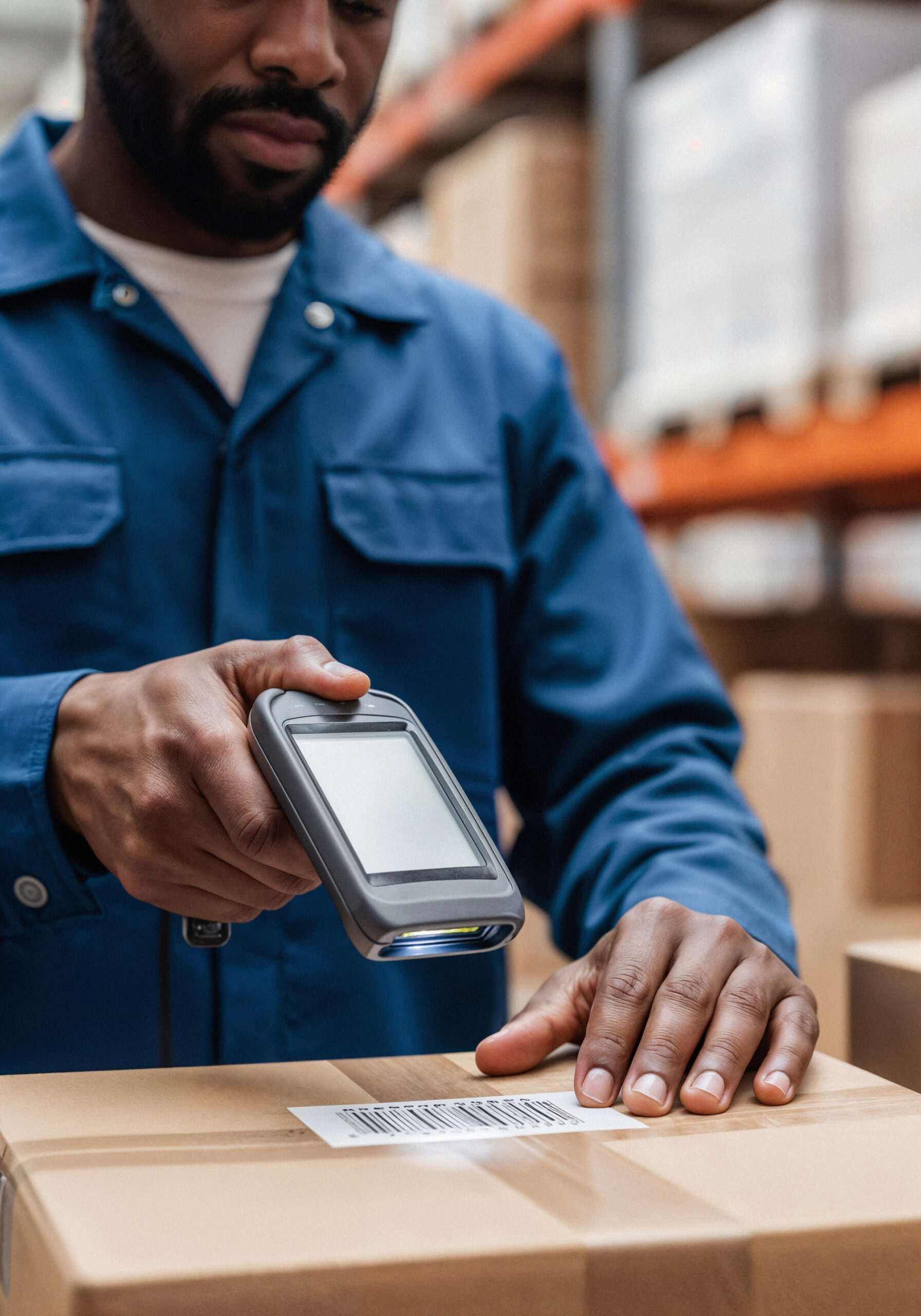 warehouse worker scanning barcode box