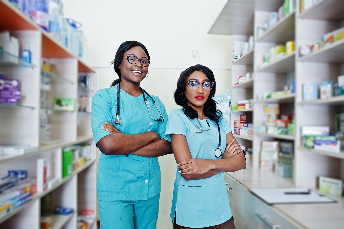 two african american pharmacist working in drugstore at hospital